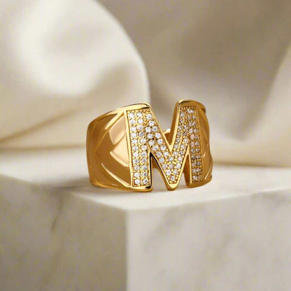 Elegant gold YourLetter Chunky Ring with adjustable design and personalized letter initial.