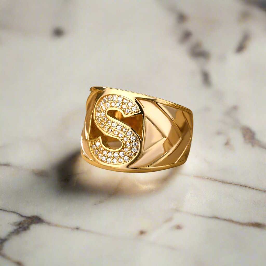 Elegant gold YourLetter Chunky Ring with customizable initial design, adjustable fit.