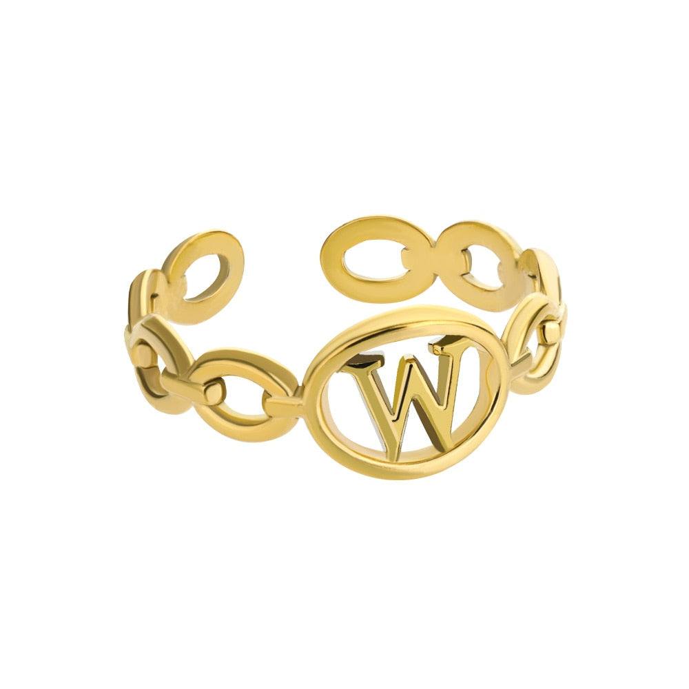 Gold custom hollow loop ring with letter W design.