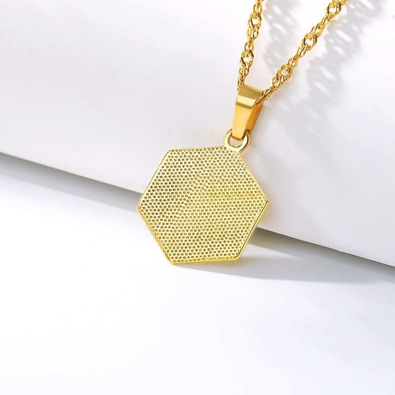 YourLetter Hexagon Embossed Necklace with gold finish and personalized letter.