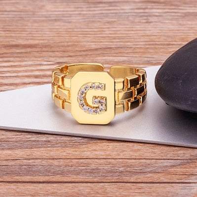 Yourletter Chunky Embossed Ring with imitation gems, customizable embossed letter, adjustable gold color.