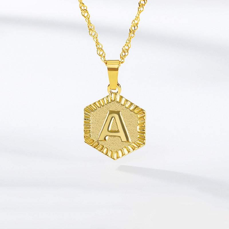 Hexagon gold necklace with embossed letter, YourLetter.