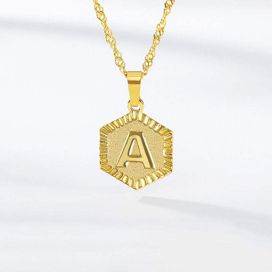 Hexagon gold necklace with embossed letter, YourLetter.