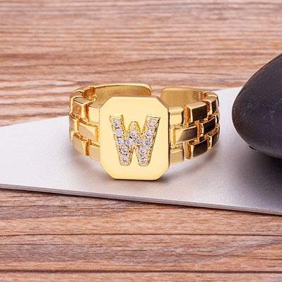 Yourletter Chunky Embossed Ring with imitation gems and gold color featuring letter "W".