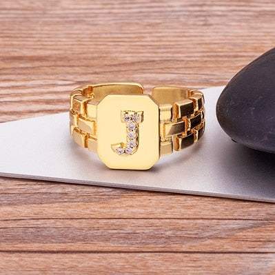 Gold Yourletter Chunky Embossed Ring with imitation gems and customizable letter.