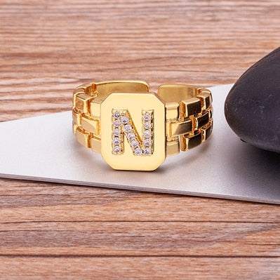 Yourletter Chunky Embossed Ring with imitation gems and adjustable gold band.