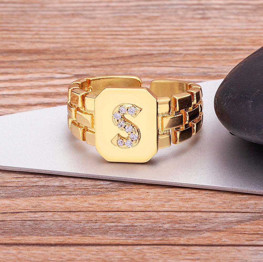 Gold chunky embossed ring with imitation gems and customizable letter S.