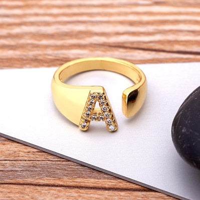 Wide YourLetter Initial Ring with cubic zirconia gems on adjustable band.