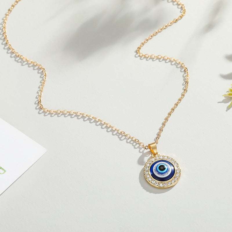 Elegant Evil Eye Necklace with gold and silver finishes and gem frame on a 50cm chain.