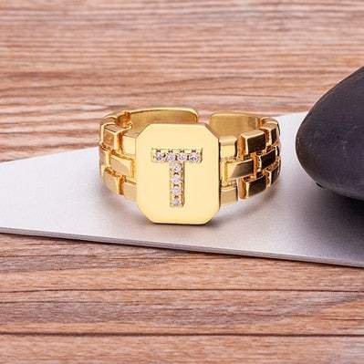 Yourletter Chunky Embossed Ring with imitation gems and adjustable gold band.