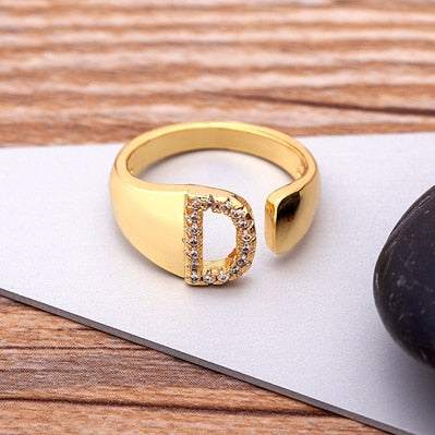 Wide YourLetter Initial Ring with cubic zirconia gems and adjustable size.