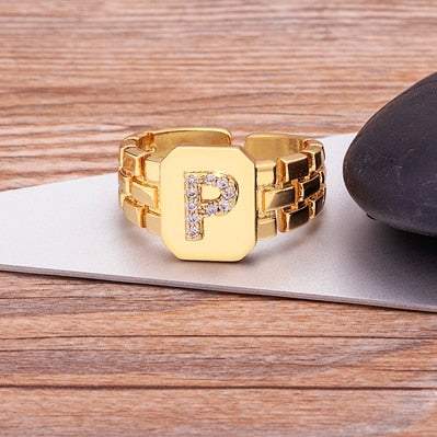 Yourletter Chunky Embossed Ring with Imitation Gems in gold color featuring an embossed letter and adjustable band.