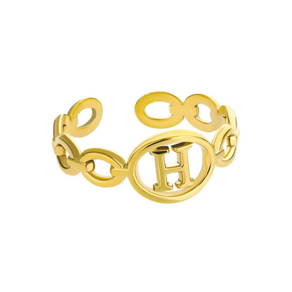 Gold hollow loop ring with customizable letter inside.