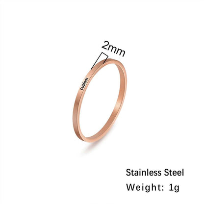 Custom engraved ring in rose gold, 2mm width, stainless steel, 1g weight.