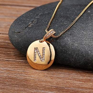 Jeweled pendant chain with letter N in gold with imitation gems.