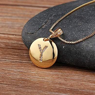 YourLetter Jeweled Pendant Chain with gold color chain and gem-encrusted letter pendant.