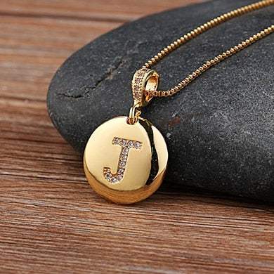 YourLetter jeweled pendant chain with gold color and gem-encrusted letter.