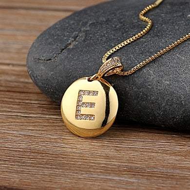 YourLetter Jeweled Pendant Chain with gold chain and gem-encrusted letter.