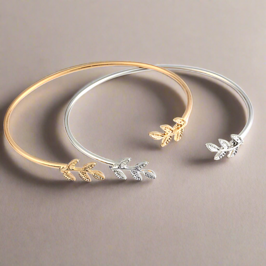 Gold and silver leaf cuff bracelets adjustable size.