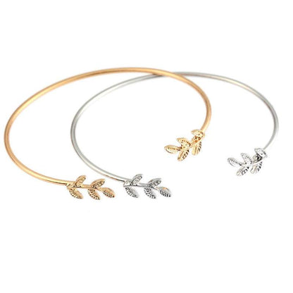 Gold and silver adjustable leaf cuff bracelets.