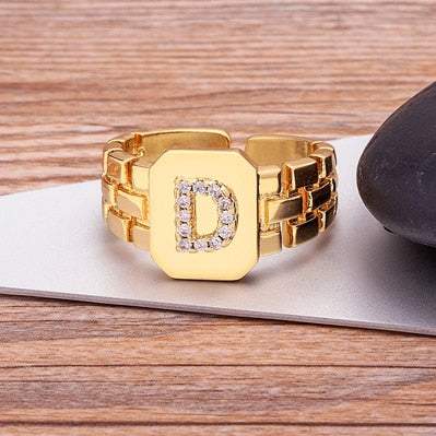 Yourletter Chunky Embossed Ring with imitation gems and embossed letter.