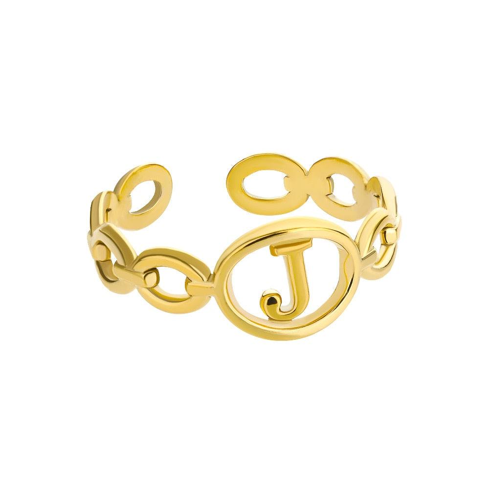 Gold adjustable hollow loop ring with customizable letter inside.