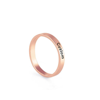 Custom engraved ring in rose gold with personalized engraving option.