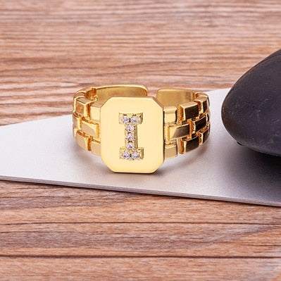 Gold Yourletter Chunky Embossed Ring with imitation gems, featuring adjustable band and customized letter design.