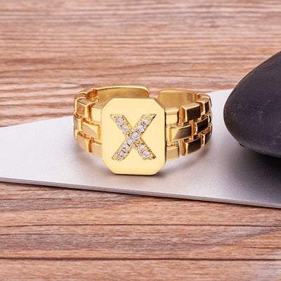 Yourletter Chunky Embossed Ring with imitation gems in adjustable gold color.