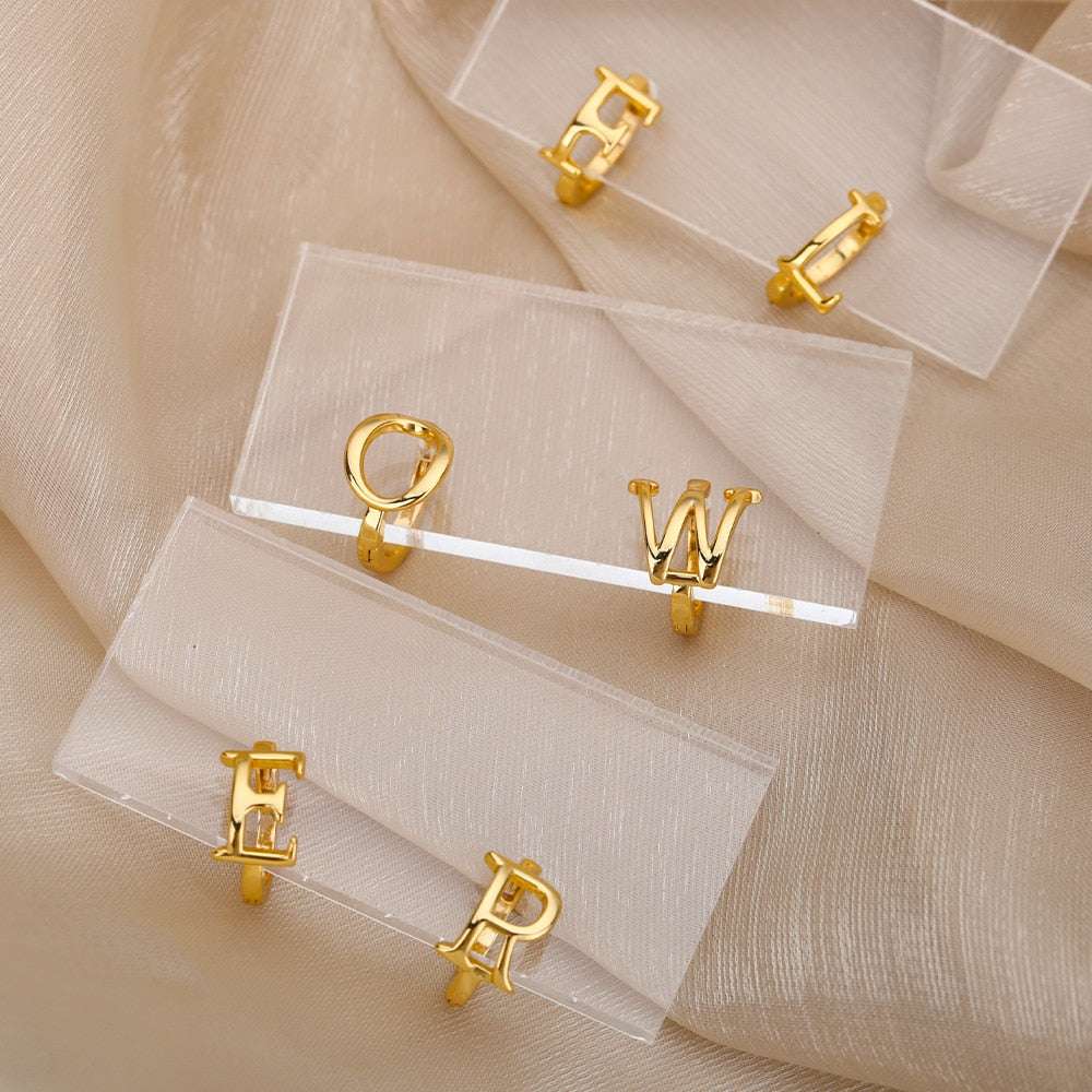 Gold initial loop earrings featuring a customizable A-Z design, stylish and chic accessory.