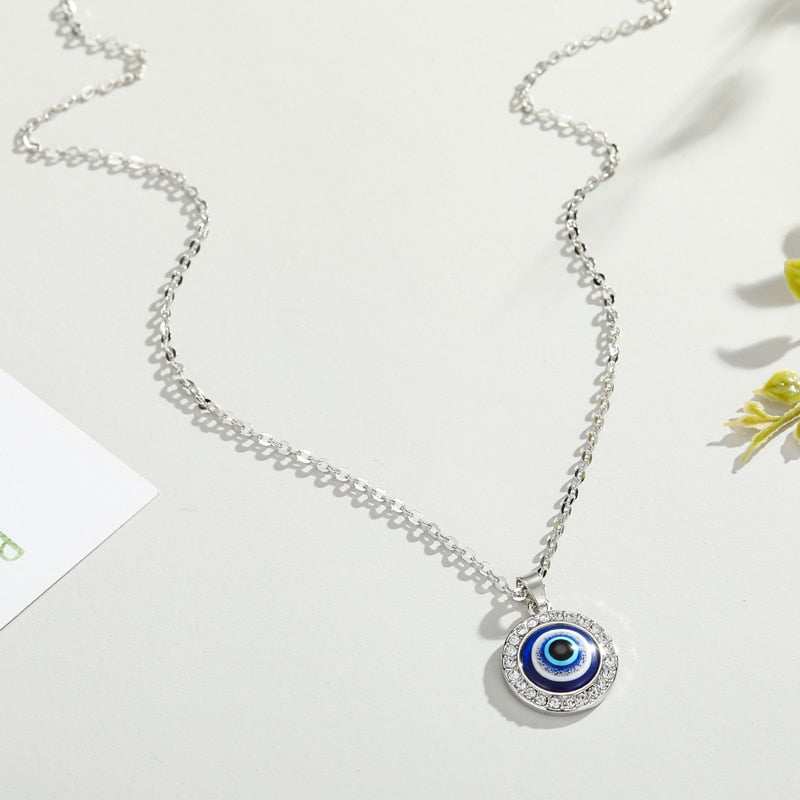 Elegant Evil Eye Necklace with gold and silver finishes and gem frame on 50cm chain.