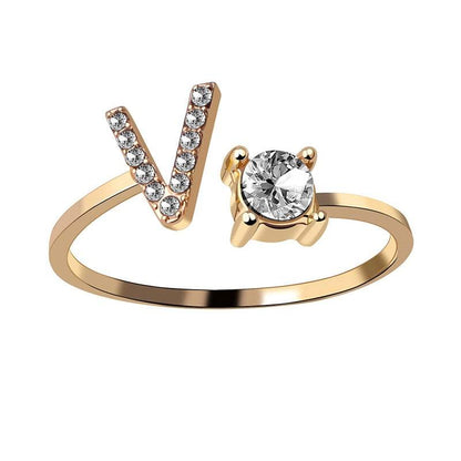 Gold adjustable letter ring with gem stud.