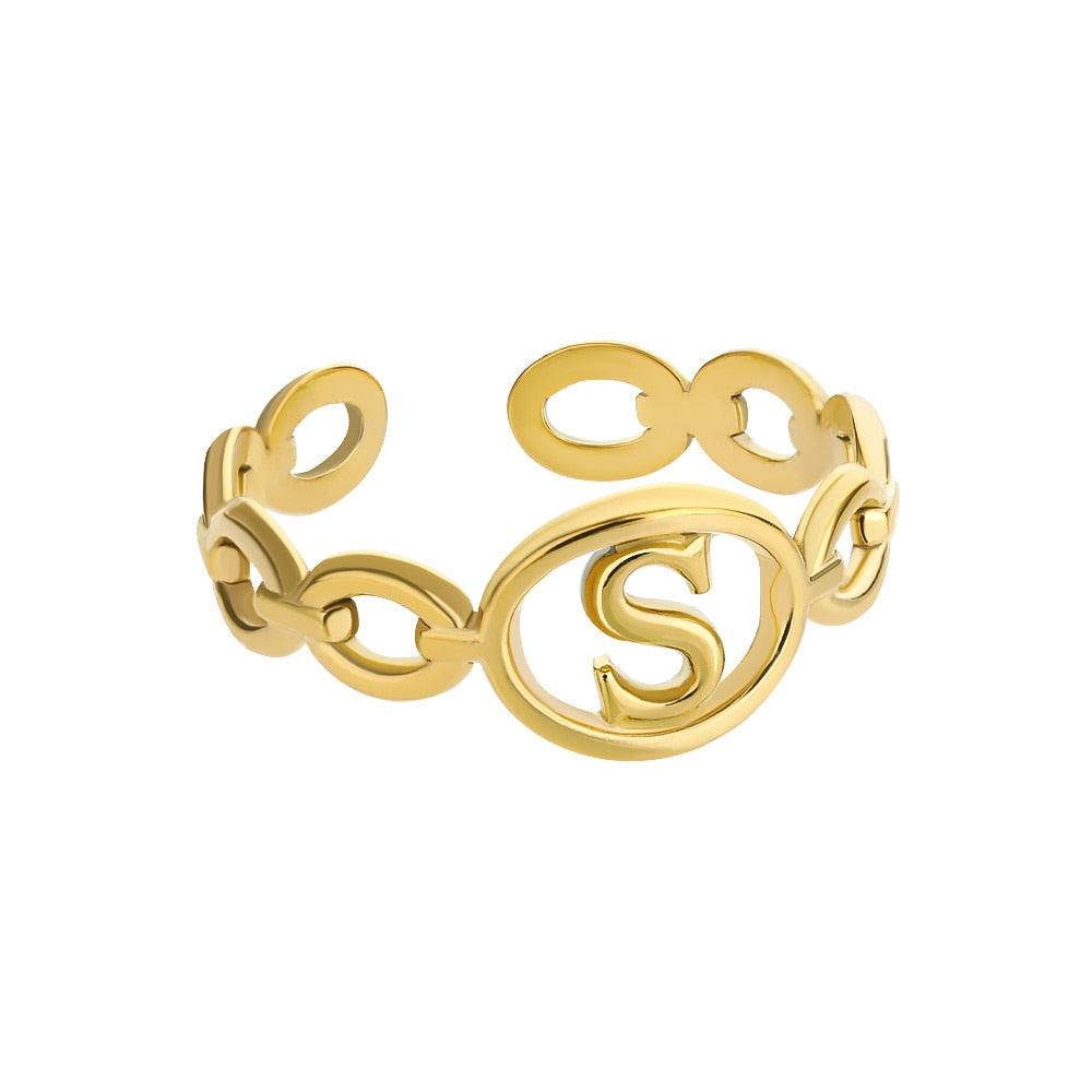 Gold adjustable hollow loop ring with custom letter S design.