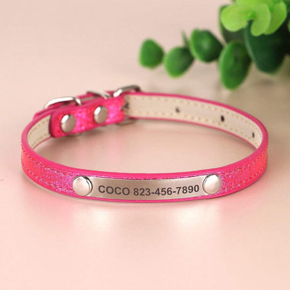 Engraved sparkly cat collar in pink displaying name and phone number.