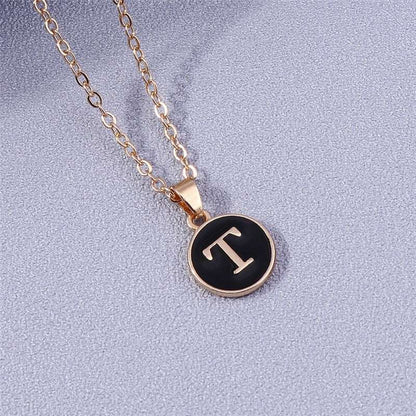 YourLetter Black Enamel Necklace with gold chain and personalized letter pendant.