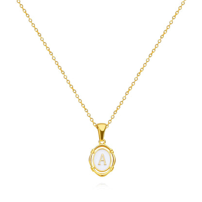 Framed YourLetter Enamel Necklace in gold with embossed letter on a 45cm chain.