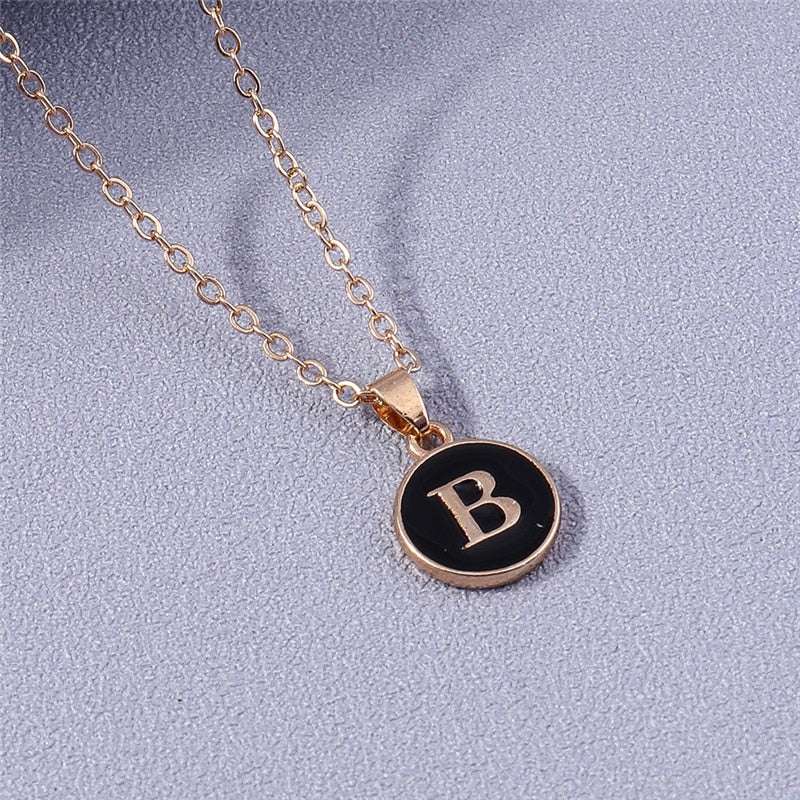 YourLetter Black Enamel Necklace with letter pendant and gold chain.