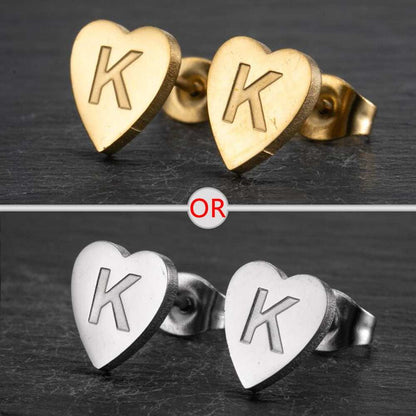 Heart stud earrings with personalized initial in silver and gold finish.