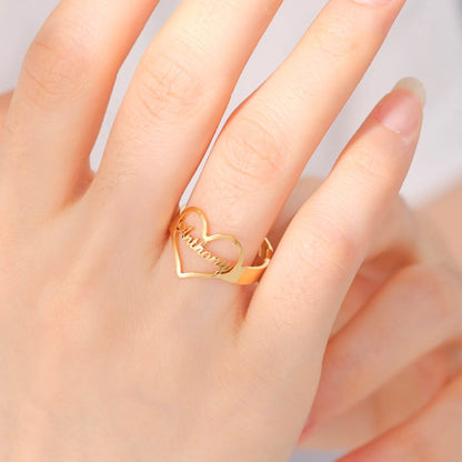 Gold heart arrow ring with personalized name engraving.