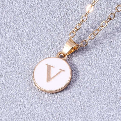 YourLetter White Enamel Circle Necklace with gold detailing and personalized initial pendant.