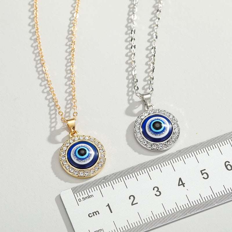 Elegant Evil Eye Necklace with gold and silver finishes, featuring gem frame on a 50cm chain.