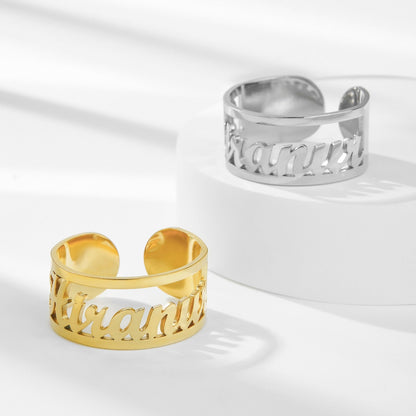 Hollow custom name rings in gold and silver, adjustable size.