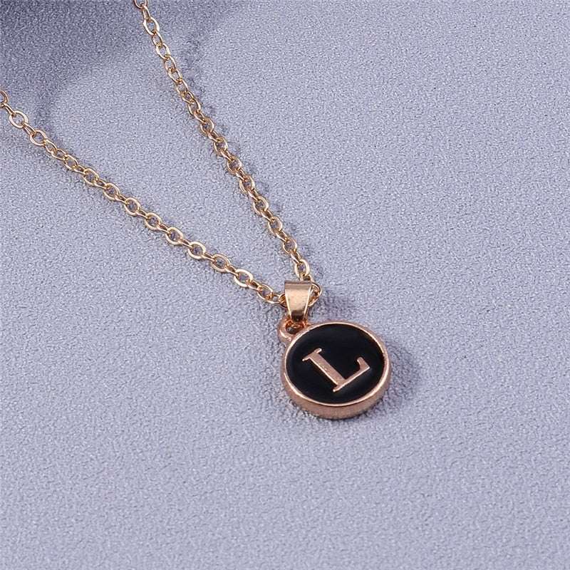 YourLetter Black Enamel Necklace with gold chain and personalized letter pendant.