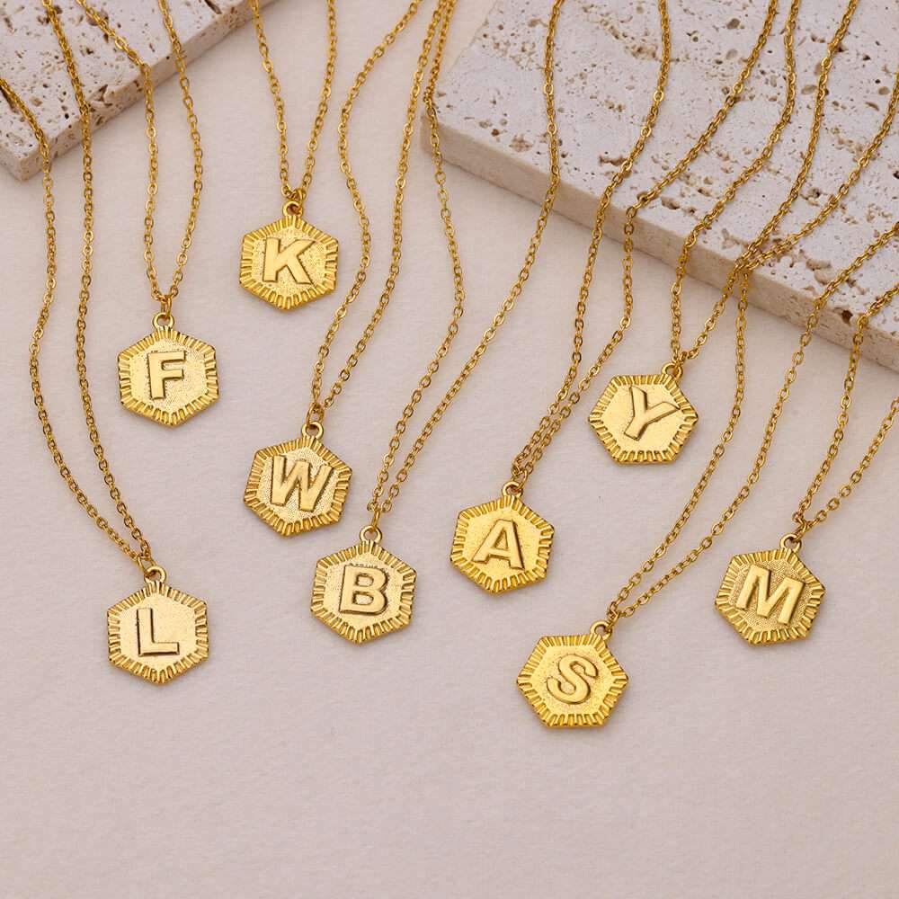 YourLetter Hexagon Embossed Necklace with gold finish and personalized letters.