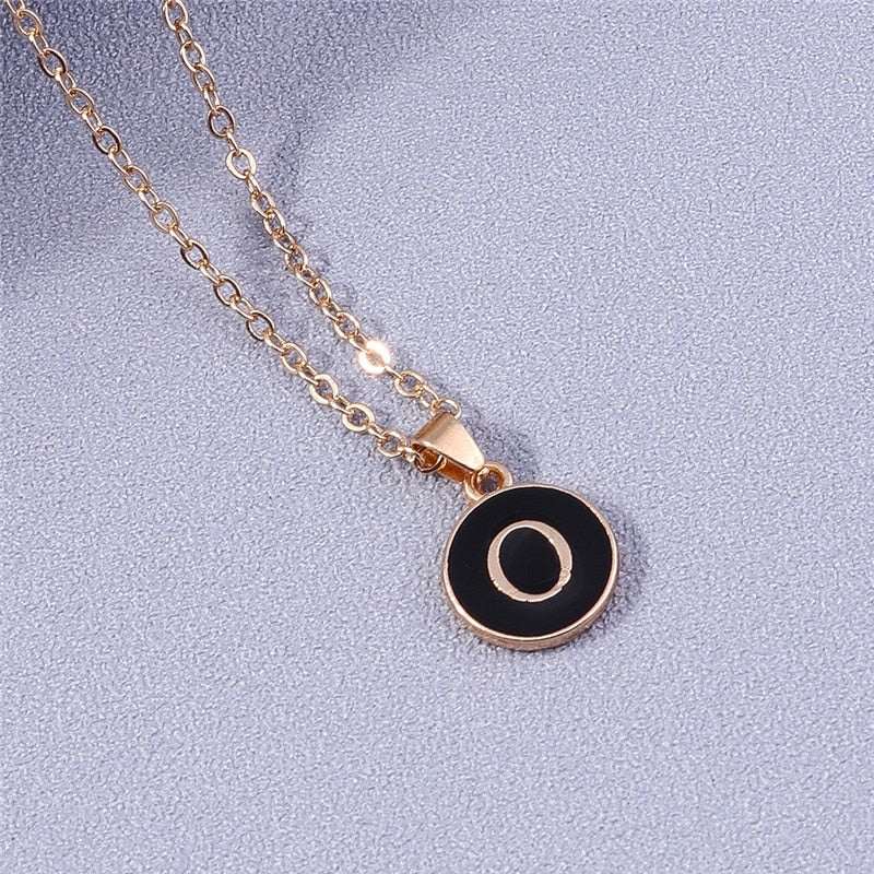 YourLetter Black Enamel Necklace with gold chain and customizable letter pendant.