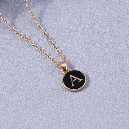 YourLetter Black Enamel Necklace with gold alloy and initial pendant.