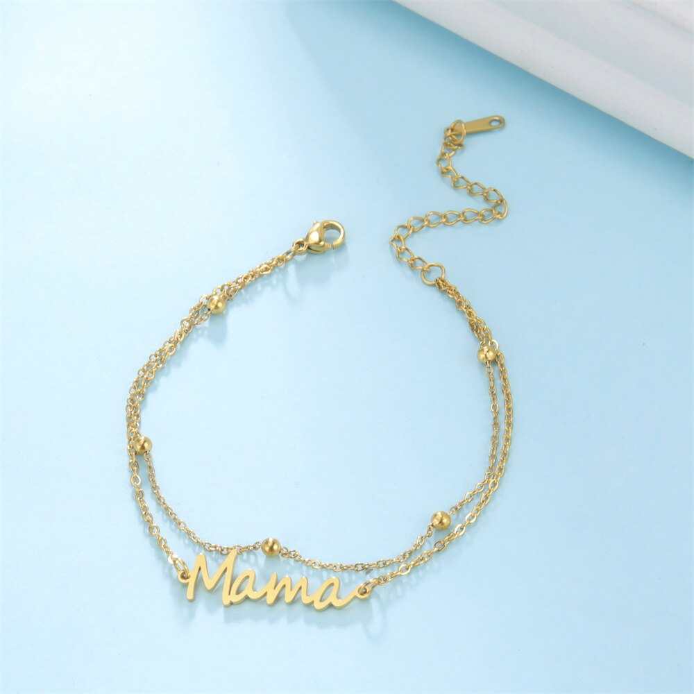 Mama bracelet with multiple style choices in gold.