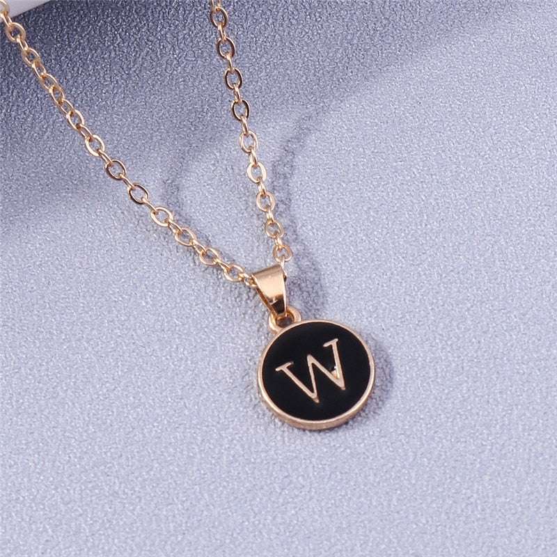 YourLetter Black Enamel Necklace with initial pendant on gold chain.