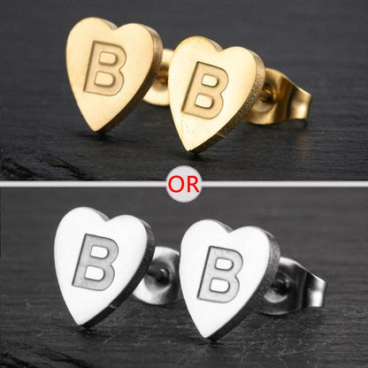 Heart-shaped stud earrings with personalized initial, available in silver and gold finish.