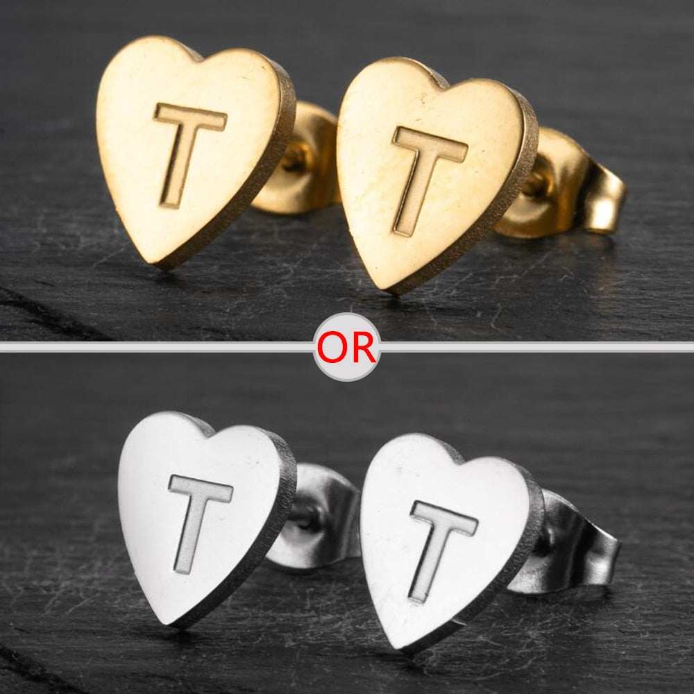 Heart-shaped stud earrings with personalized initial and gold or silver finish.